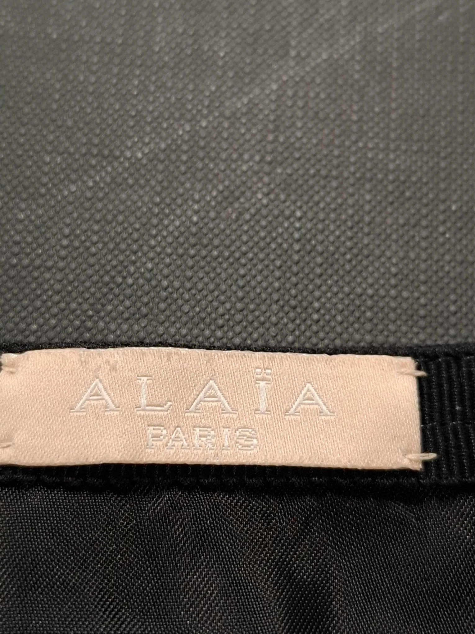 Women's Alaia Asymmetric Mini Skirt in Black Polyester - Image 6